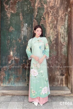 Áo dài cách tan hoàn tiet in tong xanh cốm