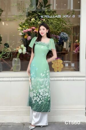 Áo dài cách tan xanh lá hoa kết nguc tay canh tiên