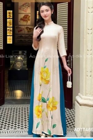 Áo dài truyền thống hoa vàng quan váy xanh