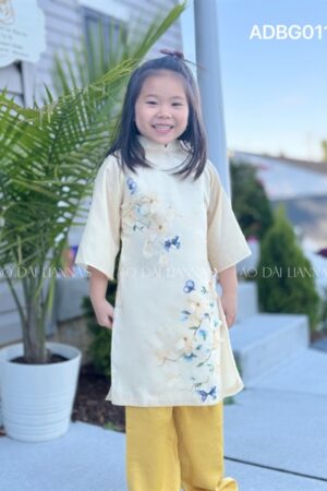 Áo dai bé gái tơ vàng ket hoa nổi