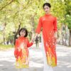 AD mẹ đón Tết đỏ quần trắng kiotviet 9ad9aa67768bff5fe09dfa250a2d5580