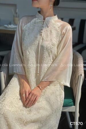 Áo dài cách tan hoa Hồng màu kem tay voan thắt nơ kiotviet b0abb5ff8e6fad4c087bdc6d083f261a