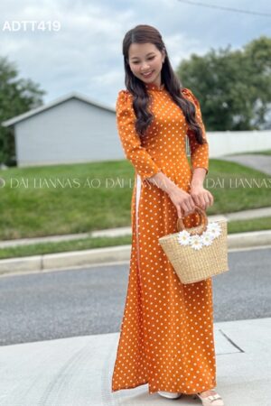 Ao dài chấm bi cam đất kiotviet d3e9a67d51a80fe3a998c834ab8ebb05