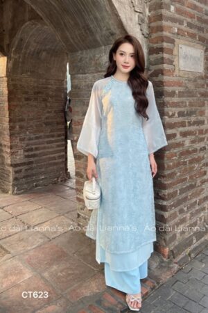 Áo dài suong hoa Hồng tong xanh dương cổ tron thắt bím