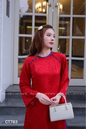 Áo dài đỏ tằm ánh kim phối viền xanh