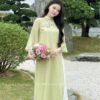 Áo dài suông xanh cốm kết hoa