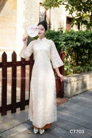 Áo dài cách Tân ren thêu hoa tong kem nút cam kiotviet b27872f963d1e21bce5a52523c532a34